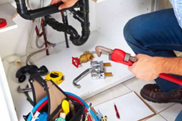image of plumber and sink replacement