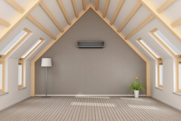 home attic with floor lamp, plant, and ductless air conditioner