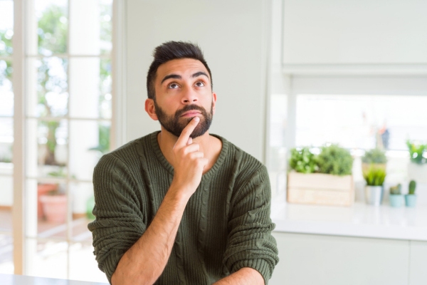 man wondering about mini duct air conditioning system