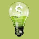 Electric light bulb and dollar symbol inside it depicting savings from oil burner cleaning