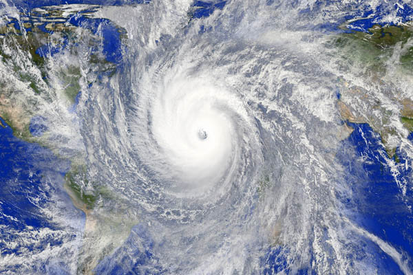 storm over globe depicting extreme weather due to climate change