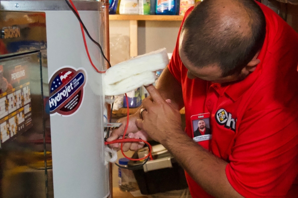 R.F. Ohl HVAC tech attending to a boiler