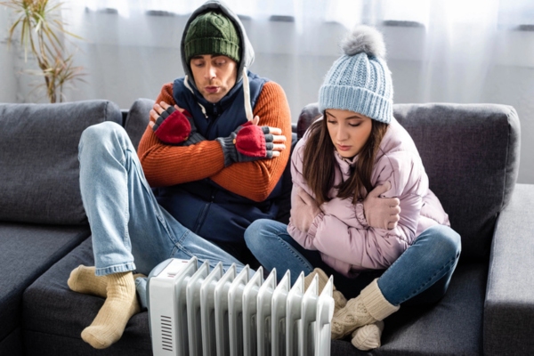 couple feeling cold due to boiler not providing heat