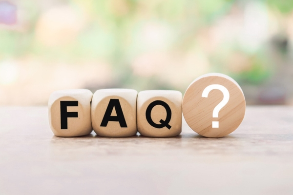 FAQ and question mark spelled using wooden blocks depicting common questions about heating